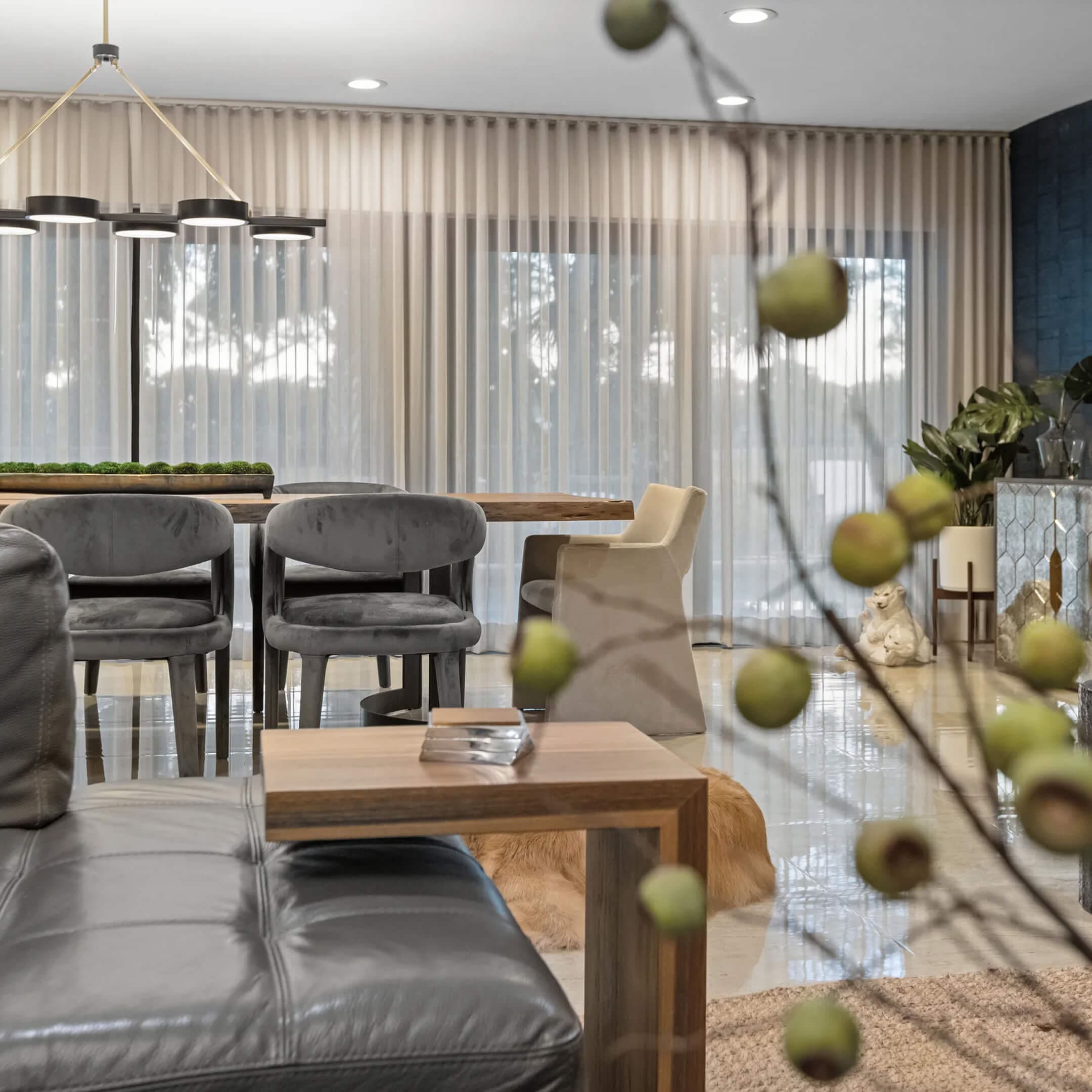 Modern living room with dining table setup.
