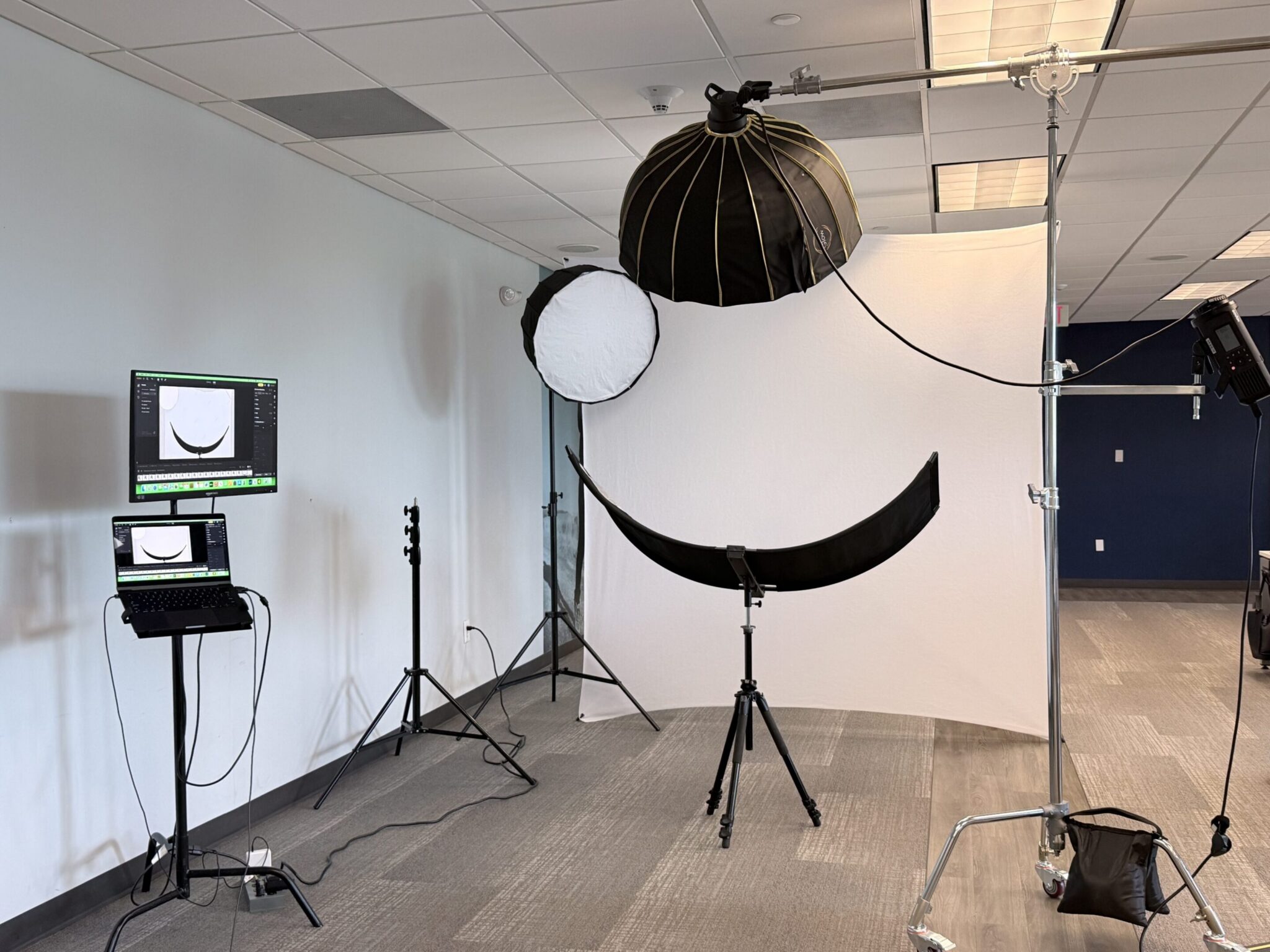 Professional photography studio setup with lighting and camera equipment.